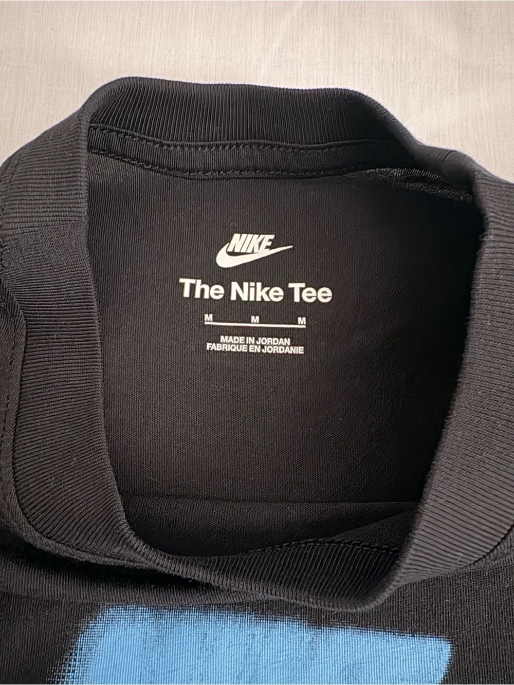 Nike Black Tee with Bright Blue Swoosh Graphic